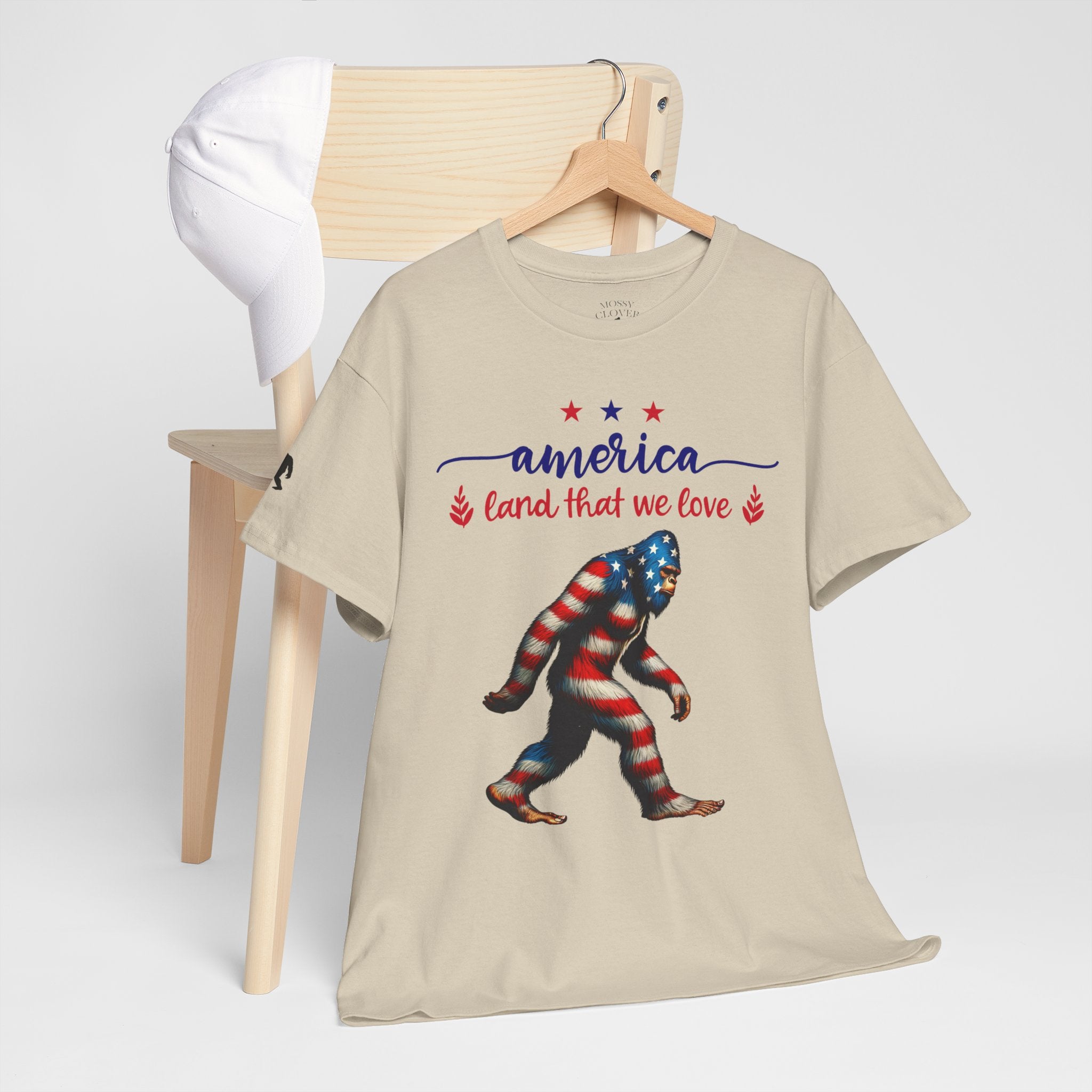 America “Land That We Love” Patriotic T‑Shirt — Flag Sasquatch Graphic Tee