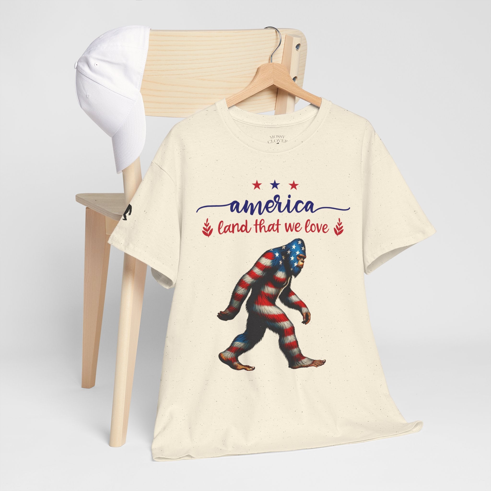 America “Land That We Love” Patriotic T‑Shirt — Flag Sasquatch Graphic Tee